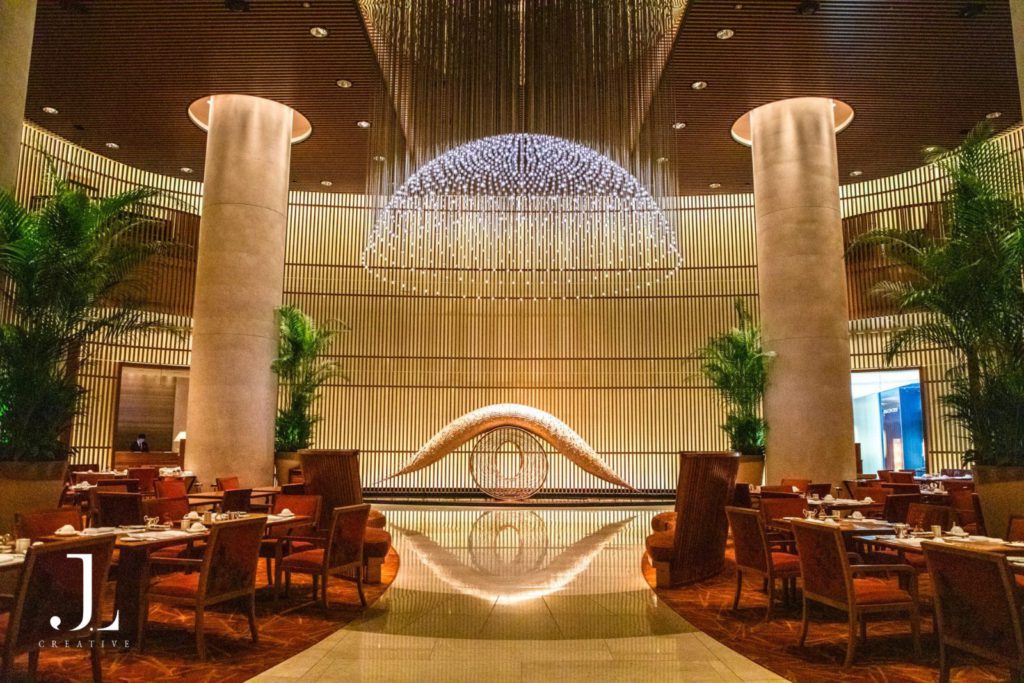 Luxury dining room interior at The Peninsula Tokyo featuring a grand light installation