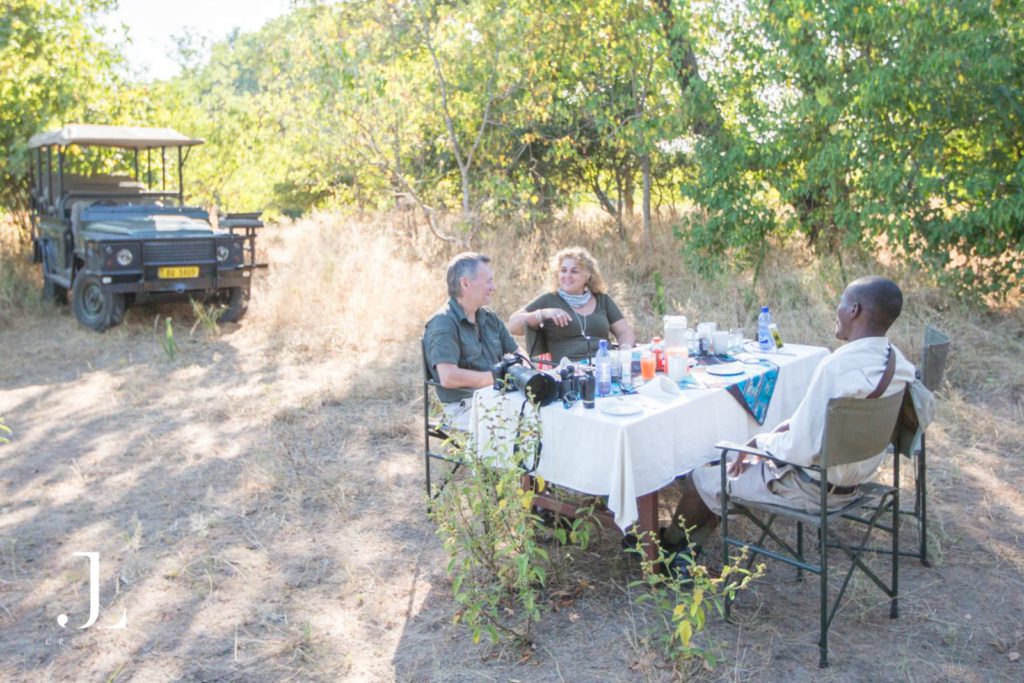 Guests enjoying sunset drinks at Mvuu Safari Lodge