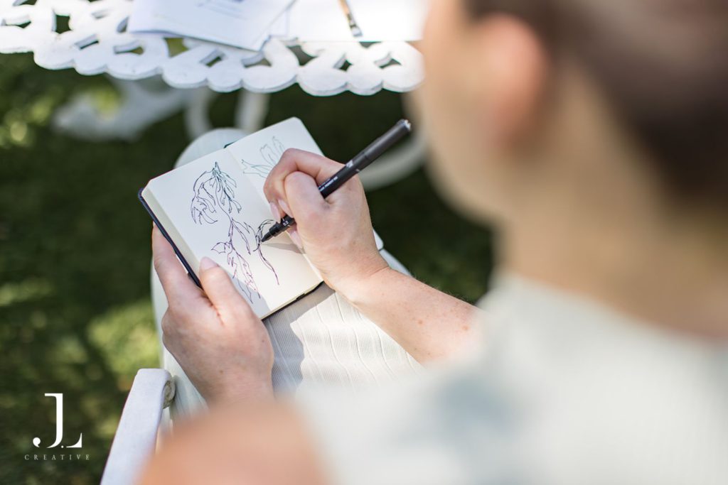 Guests participating in a nature-inspired wellness session in a shaded woodland clearing