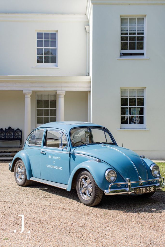 restored vintage electric car arriving at the Belmond Secret Retreat, Knepp Estate