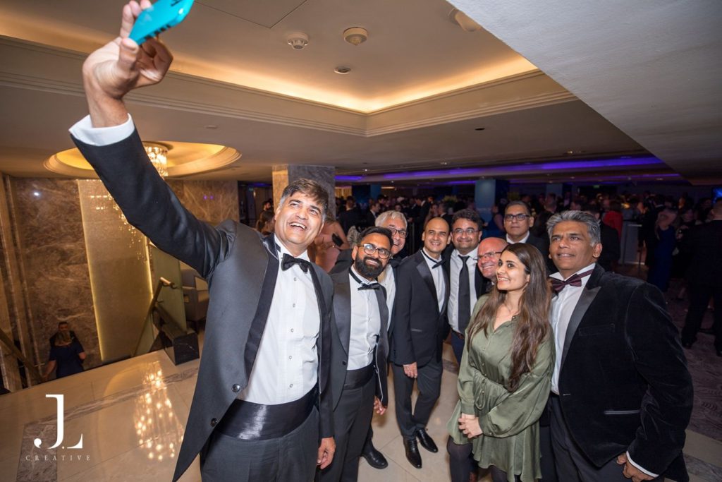 Group of guests taking a selfie at a London gala dinner