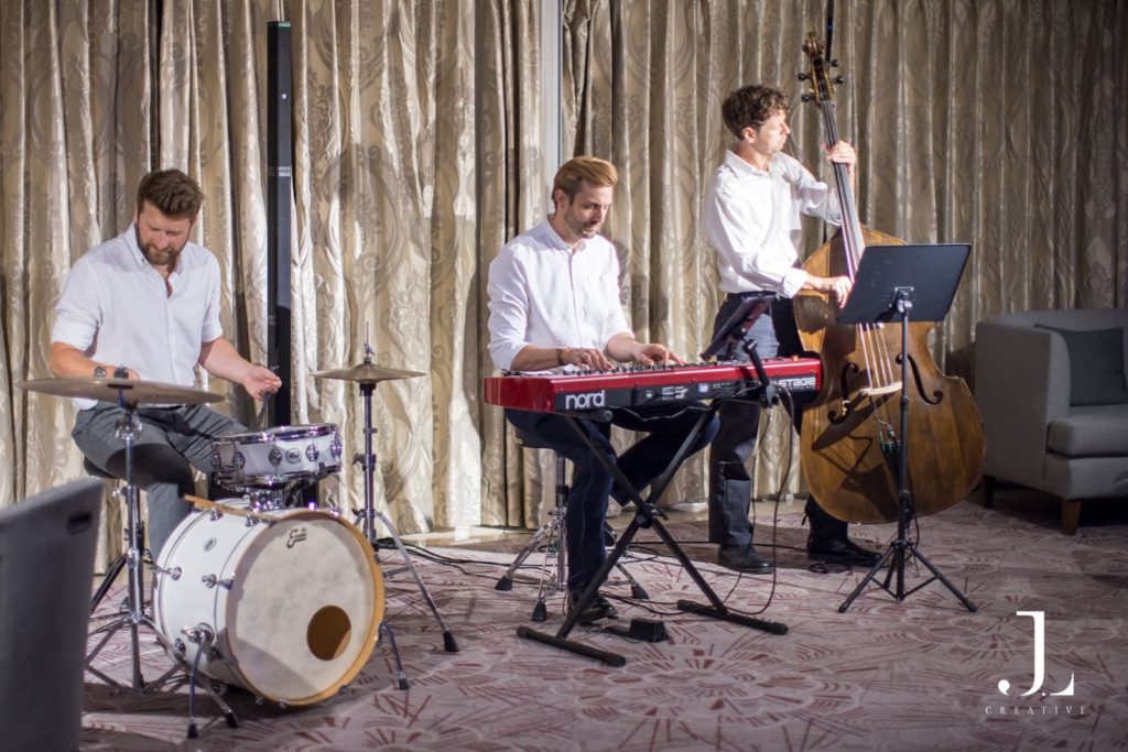 Live jazz trio performing at a corporate event in London
