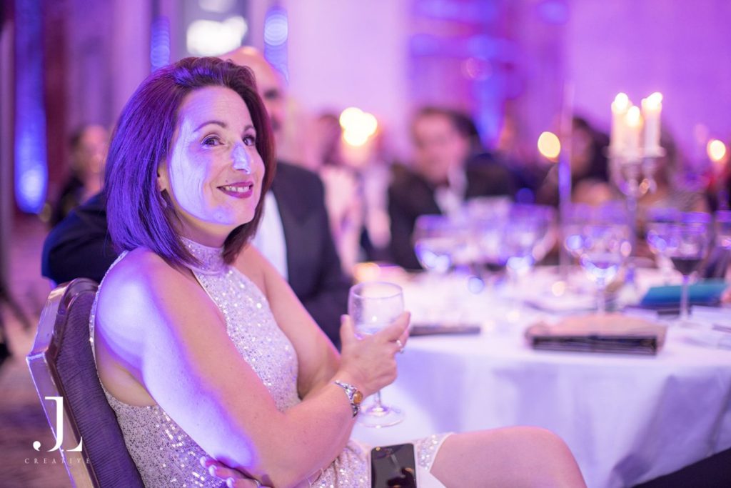 Candid photo of a guest at a formal London gala dinner