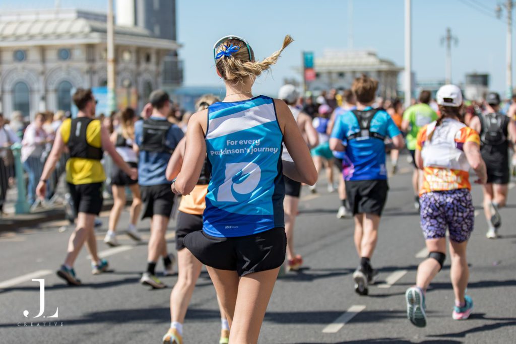 Charity runners at London Marathon wearing branded t-shirts