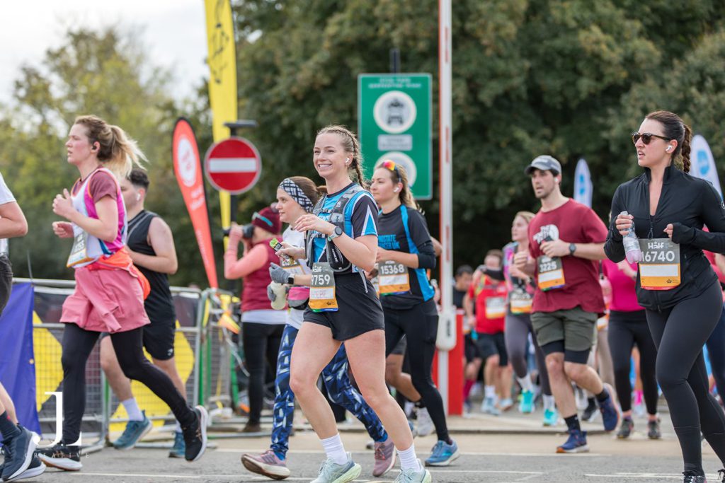 Charity runners at London Marathon wearing branded t-shirts