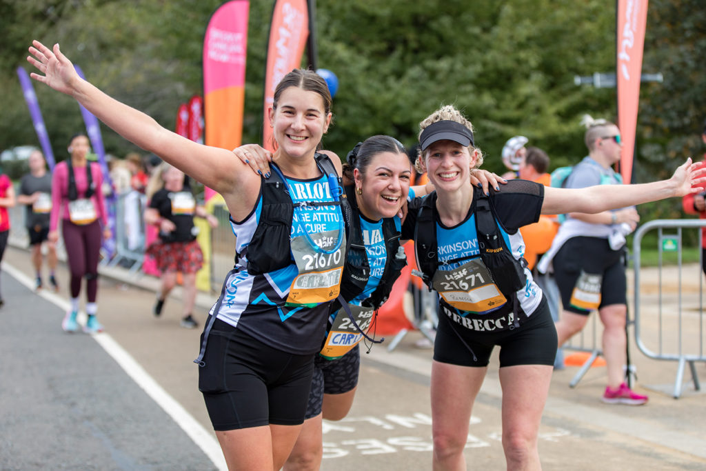 Charity runners at London Marathon wearing branded t-shirts