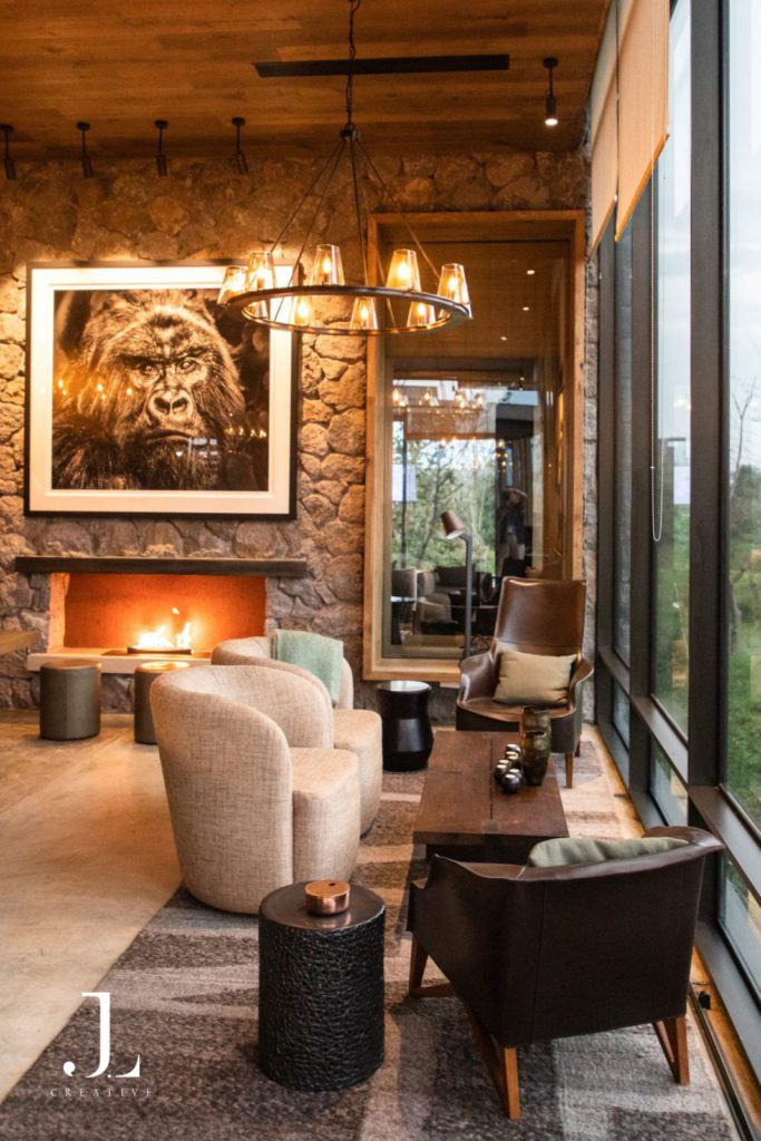 Luxury retreat photography of an elegant lodge interior with a fireplace and stylish seating at a boutique hotel.