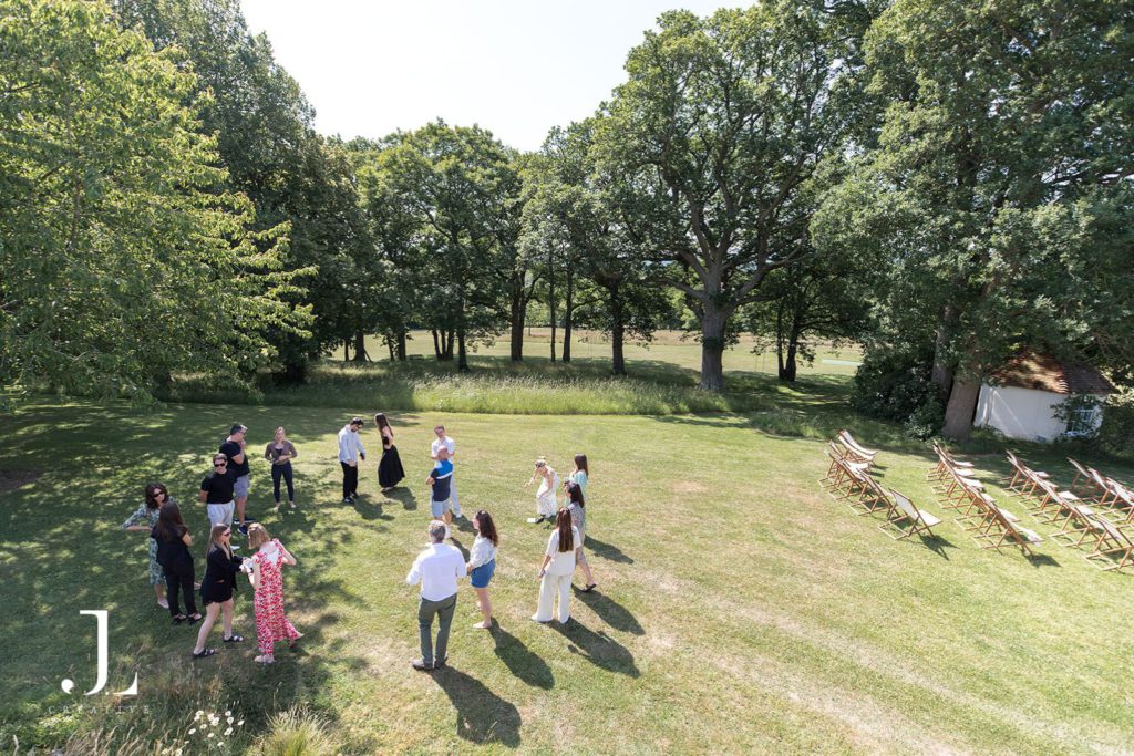 High-angle shot of an exclusive garden party and networking event at a beautiful luxury estate.