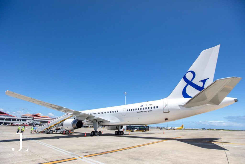 Luxury event photography of a private jet on an airport tarmac, ready for a high-end international journey.