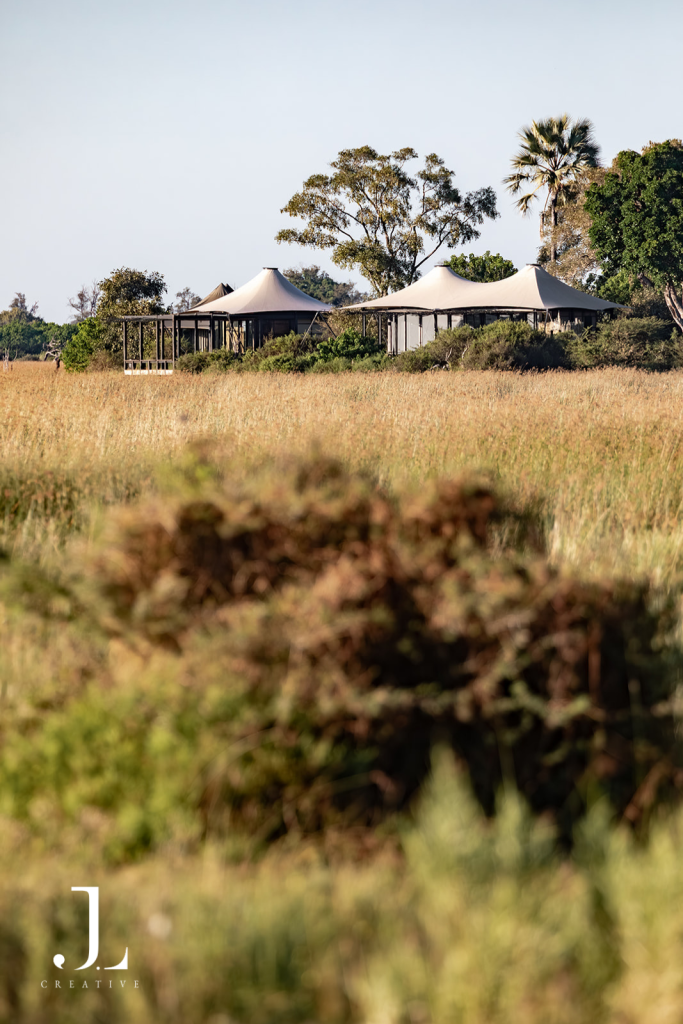 Luxury tented suites set against the open wilderness, featuring safari camp photography Botswana.